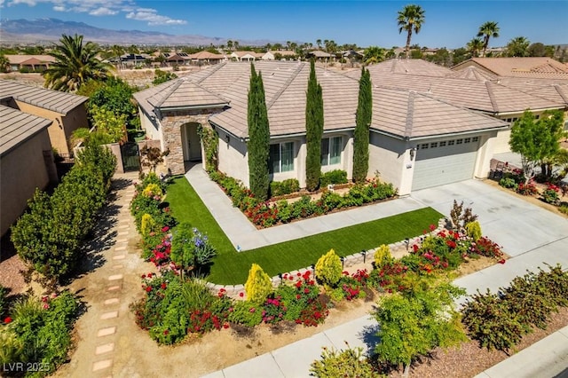 8221 Bay Dunes St, Las Vegas, NV 89131 - view of front of property with stucco siding, an attached garage, concrete driveway, a tile roof, and a residential view