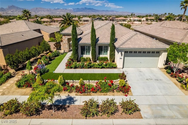 8221 Bay Dunes St, Las Vegas, NV 89131 - single story home featuring an attached garage, driveway, a residential view, stucco siding, and a tiled roof