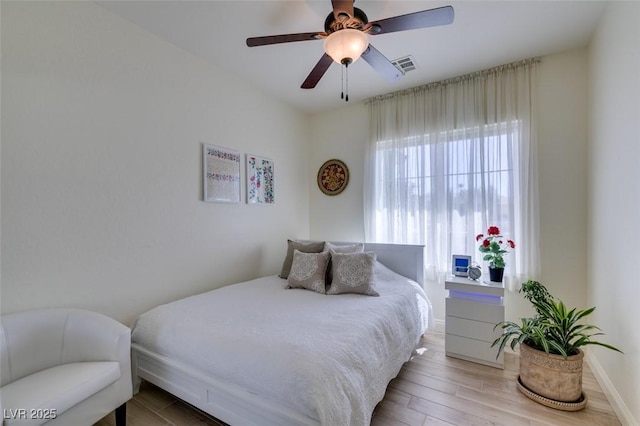 8221 Bay Dunes St, Las Vegas, NV 89131 - bedroom with light wood finished floors, ceiling fan, and baseboards