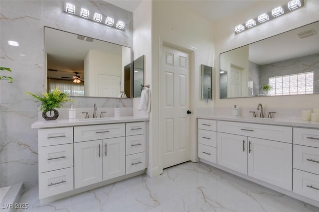 8221 Bay Dunes St, Las Vegas, NV 89131 - full bathroom with two vanities, marble finish flooring, and a ceiling fan