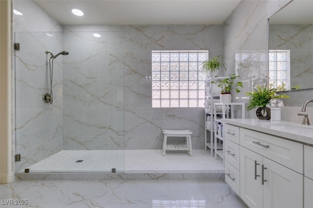 8221 Bay Dunes St, Las Vegas, NV 89131 - full bathroom featuring vanity, a marble finish shower, and healthy amount of natural light