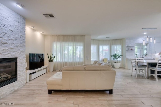 8221 Bay Dunes St, Las Vegas, NV 89131 - living room with wood finished floors and a fireplace