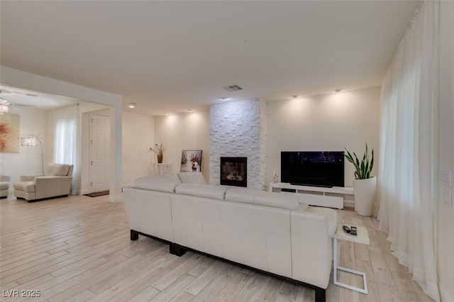 8221 Bay Dunes St, Las Vegas, NV 89131 - living area featuring light wood-style floors and a fireplace