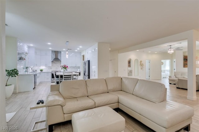 8221 Bay Dunes St, Las Vegas, NV 89131 - living room featuring ceiling fan, recessed lighting, and light wood-type flooring