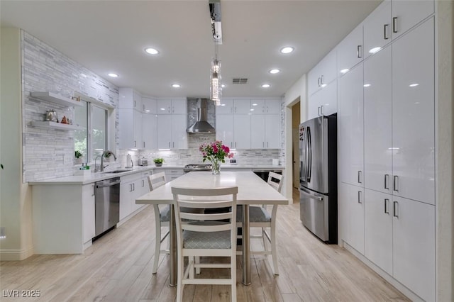 8221 Bay Dunes St, Las Vegas, NV 89131 - kitchen featuring stainless steel appliances, wall chimney exhaust hood, a sink, backsplash, and recessed lighting