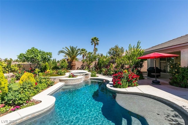 8221 Bay Dunes St, Las Vegas, NV 89131 - view of swimming pool featuring a fenced backyard, a patio area, and a pool with connected hot tub