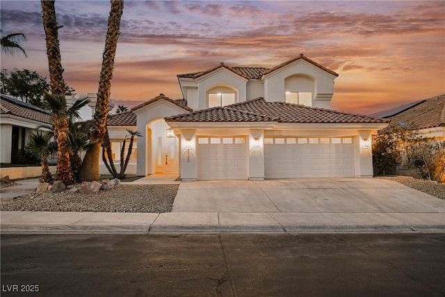 8104 Bay Harbor Dr, Las Vegas, NV 89128 - mediterranean / spanish-style house with stucco siding, concrete driveway, a garage, and a tiled roof