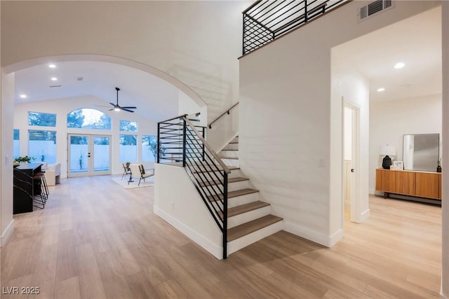 8104 Bay Harbor Dr, Las Vegas, NV 89128 - entryway featuring arched walkways, high vaulted ceiling, light wood-style floors, ceiling fan, and baseboards
