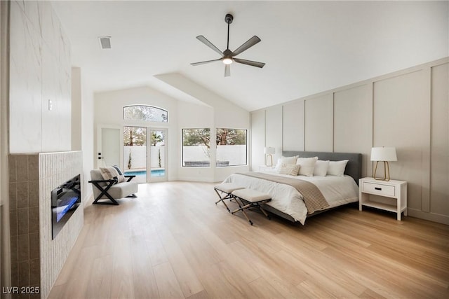 8104 Bay Harbor Dr, Las Vegas, NV 89128 - bedroom with access to exterior, light wood finished floors, high vaulted ceiling, and ceiling fan