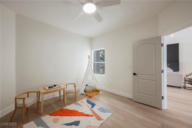 8104 Bay Harbor Dr, Las Vegas, NV 89128 - playroom with ceiling fan, baseboards, and light wood-style flooring