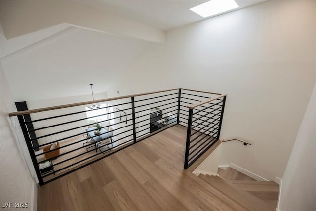 8104 Bay Harbor Dr, Las Vegas, NV 89128 - staircase with wood finished floors and a skylight