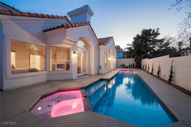 8104 Bay Harbor Dr, Las Vegas, NV 89128 - view of pool featuring a patio area, a fenced backyard, and a pool with connected hot tub