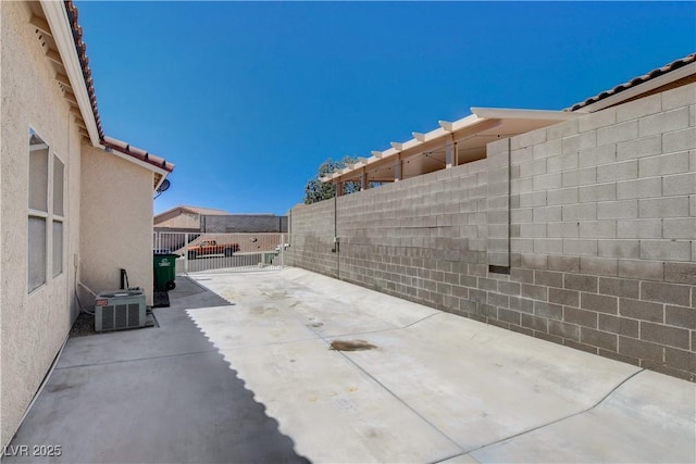 805 Palmero Way, Boulder City, NV 89005 - fenced backyard featuring cooling unit and a patio area