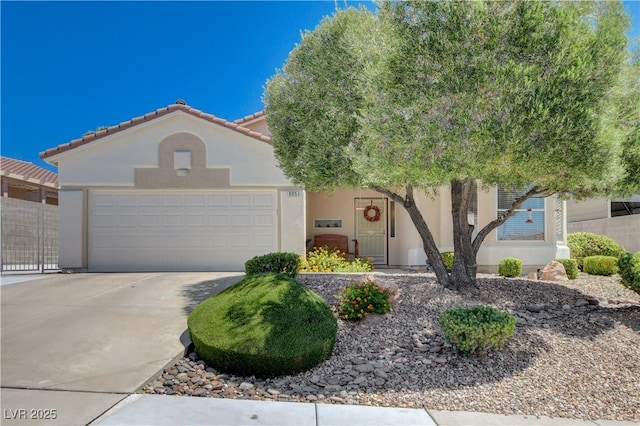 805 Palmero Way, Boulder City, NV 89005 - view of front of property with a garage, driveway, stucco siding, and a tiled roof