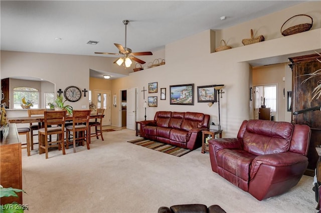 805 Palmero Way, Boulder City, NV 89005 - living area with carpet floors, arched walkways, plenty of natural light, a ceiling fan, and high vaulted ceiling