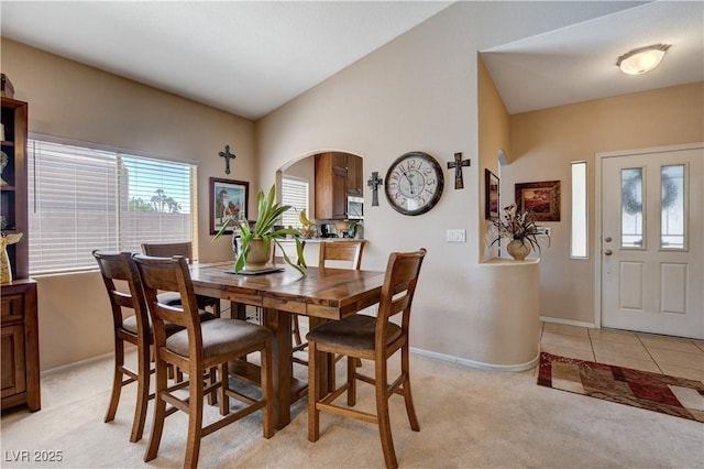 805 Palmero Way, Boulder City, NV 89005 - dining room featuring light carpet, baseboards, and arched walkways