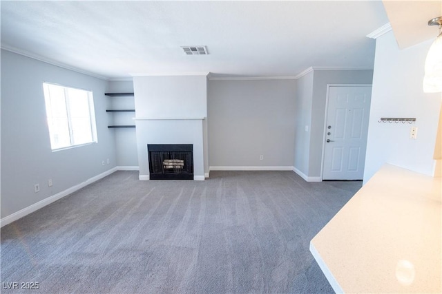 8600 W Charleston Blvd Unit 2068, Las Vegas, NV 89117 - unfurnished living room with crown molding, carpet flooring, baseboards, and a fireplace