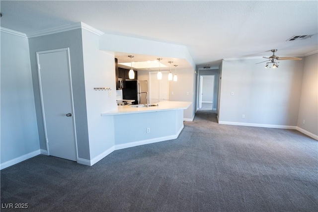 8600 W Charleston Blvd Unit 2068, Las Vegas, NV 89117 - unfurnished living room featuring crown molding, dark carpet, ceiling fan, baseboards, and a sink