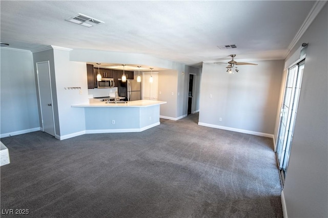 8600 W Charleston Blvd Unit 2068, Las Vegas, NV 89117 - unfurnished living room featuring baseboards, ceiling fan, crown molding, and dark colored carpet