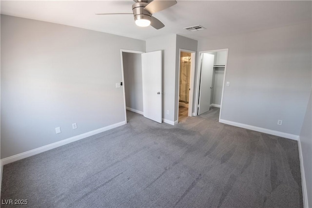 8600 W Charleston Blvd Unit 2068, Las Vegas, NV 89117 - unfurnished bedroom with baseboards, carpet flooring, connected bathroom, ceiling fan, and a walk in closet