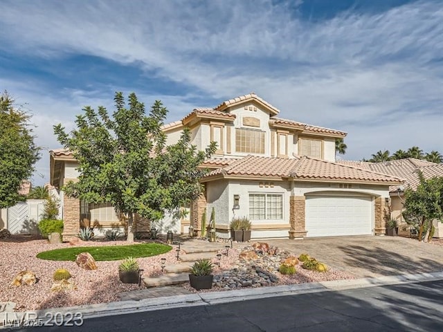 9718 Camino Capistrano Ln, Las Vegas, NV 89147 - mediterranean / spanish house featuring asphalt driveway, stucco siding, an attached garage, and a tile roof