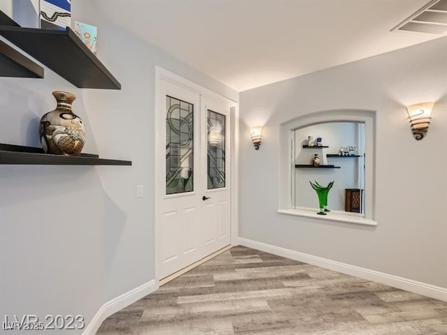9718 Camino Capistrano Ln, Las Vegas, NV 89147 - doorway to outside with wood finished floors and baseboards