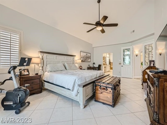 9718 Camino Capistrano Ln, Las Vegas, NV 89147 - bedroom with lofted ceiling, light tile patterned flooring, a ceiling fan, ensuite bath, and baseboards