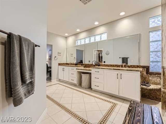 9718 Camino Capistrano Ln, Las Vegas, NV 89147 - full bath with double vanity, healthy amount of natural light, recessed lighting, and tile patterned floors