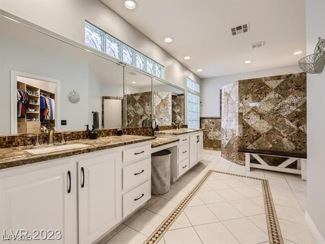 9718 Camino Capistrano Ln, Las Vegas, NV 89147 - full bath featuring healthy amount of natural light, vanity, walk in shower, recessed lighting, and tile walls