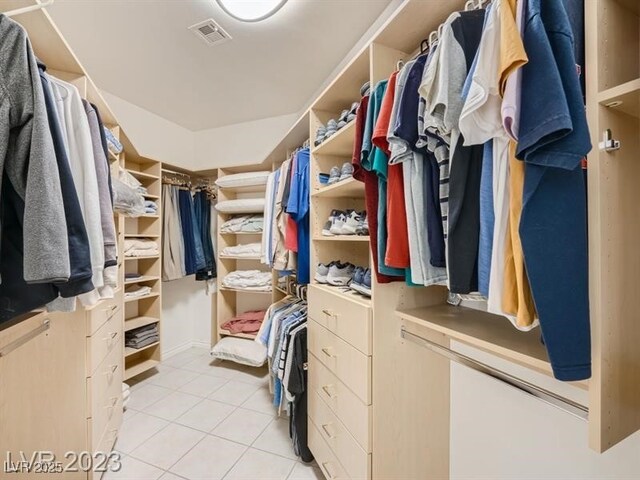 9718 Camino Capistrano Ln, Las Vegas, NV 89147 - walk in closet featuring light tile patterned floors