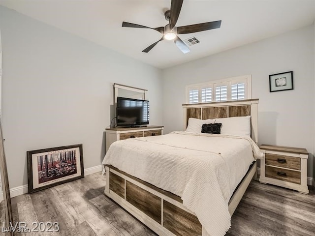 9718 Camino Capistrano Ln, Las Vegas, NV 89147 - bedroom with wood finished floors, baseboards, and ceiling fan
