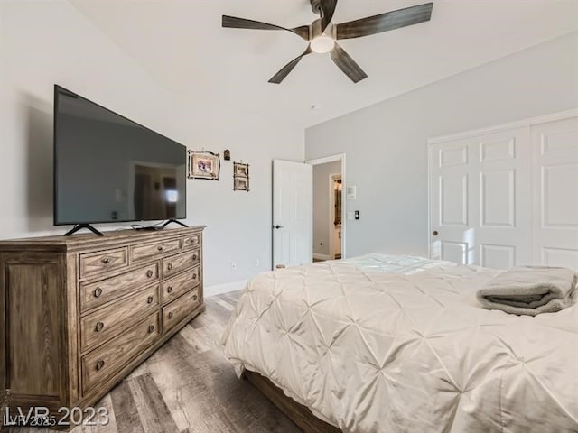 9718 Camino Capistrano Ln, Las Vegas, NV 89147 - bedroom with wood finished floors, a ceiling fan, and baseboards