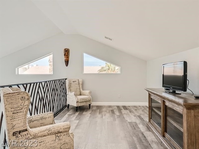 9718 Camino Capistrano Ln, Las Vegas, NV 89147 - living area with wood finished floors, vaulted ceiling, and baseboards