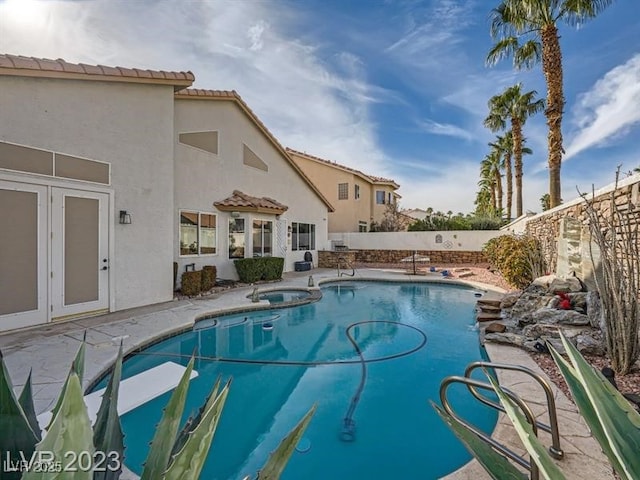 9718 Camino Capistrano Ln, Las Vegas, NV 89147 - view of pool with a fenced backyard, a patio, and a pool with connected hot tub