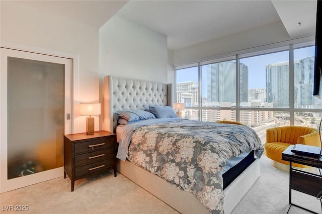 4525 Dean Martin Dr Unit 901, Las Vegas, NV 89103 - bedroom with light carpet and a skyline view
