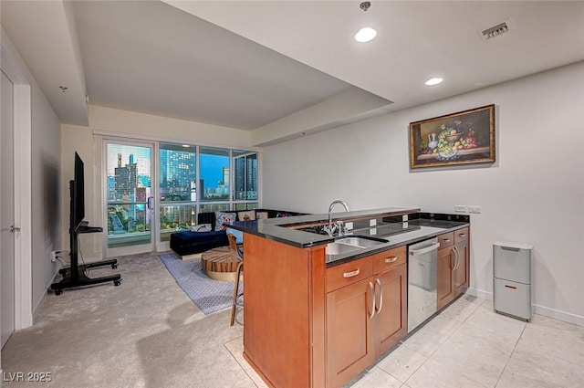 4525 Dean Martin Dr Unit 901, Las Vegas, NV 89103 - kitchen featuring stainless steel dishwasher, a sink, dark countertops, brown cabinets, and a kitchen bar