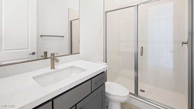 362 Tigullio Ave, Henderson, NV 89011 - bathroom with vanity, a shower stall, and toilet