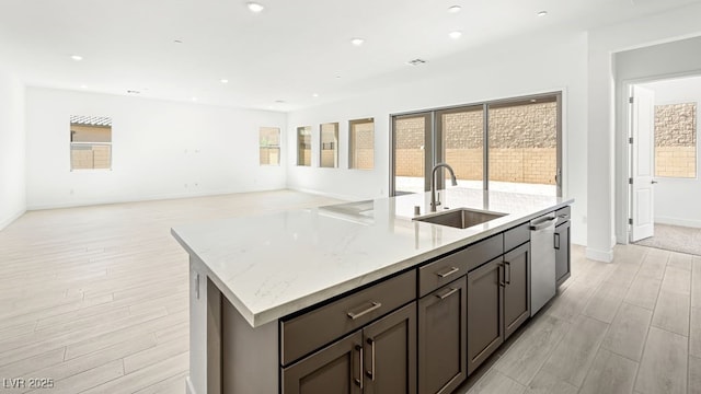 362 Tigullio Ave, Henderson, NV 89011 - kitchen with a sink, dishwasher, a kitchen island with sink, light wood-style floors, and healthy amount of natural light