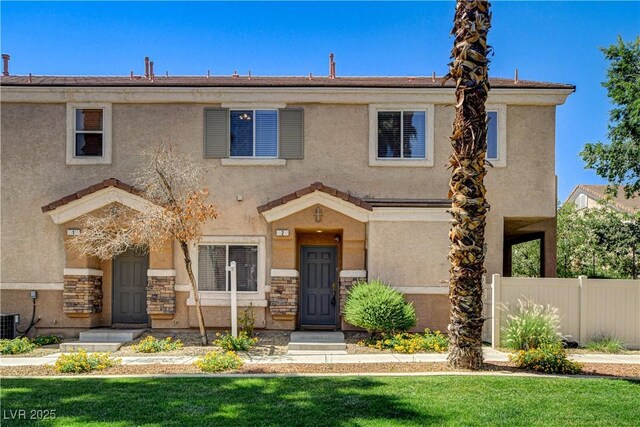 67 Dow Jones St Unit 2, Henderson, NV 89074 - view of front of home featuring stone siding and stucco siding