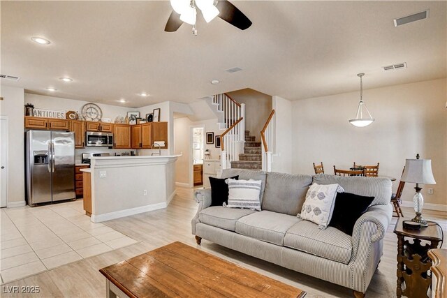 67 Dow Jones St Unit 2, Henderson, NV 89074 - living room featuring a ceiling fan, stairway, baseboards, recessed lighting, and light wood-style flooring