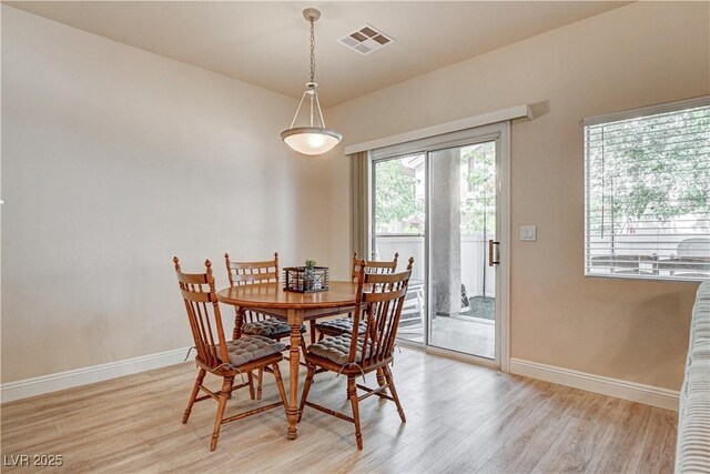 67 Dow Jones St Unit 2, Henderson, NV 89074 - dining room with light wood-style floors and baseboards