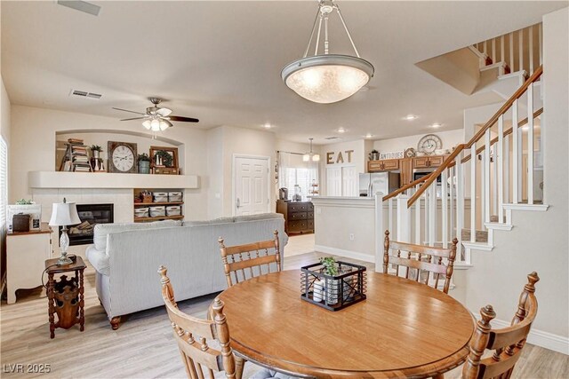 67 Dow Jones St Unit 2, Henderson, NV 89074 - dining room featuring light wood-type flooring, stairway, a ceiling fan, baseboards, and recessed lighting