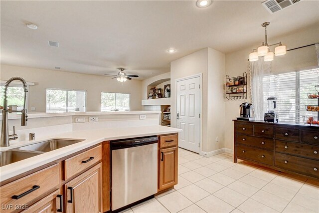 67 Dow Jones St Unit 2, Henderson, NV 89074 - kitchen with stainless steel dishwasher, a sink, light countertops, light tile patterned flooring, and pendant lighting