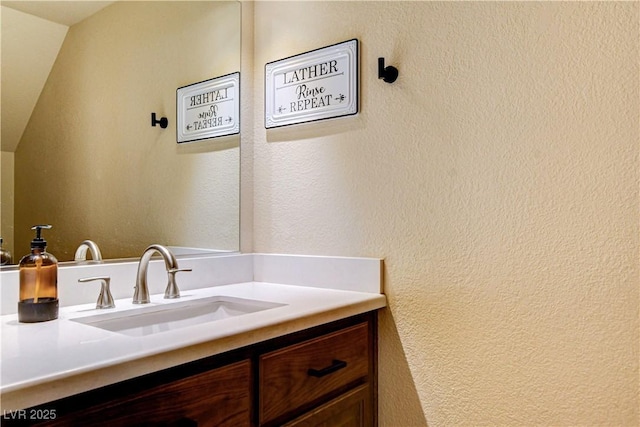 67 Dow Jones St Unit 2, Henderson, NV 89074 - bathroom featuring vanity and a textured wall