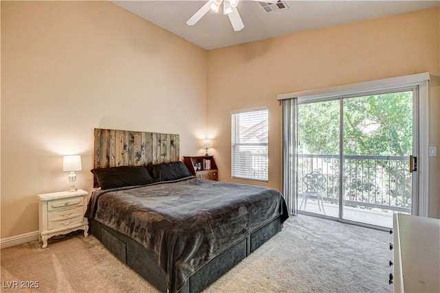 67 Dow Jones St Unit 2, Henderson, NV 89074 - bedroom with access to outside, light colored carpet, a ceiling fan, and baseboards