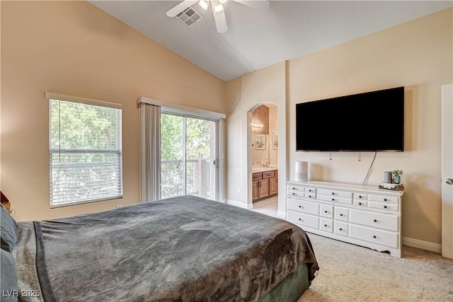 67 Dow Jones St Unit 2, Henderson, NV 89074 - bedroom with arched walkways, vaulted ceiling, ensuite bathroom, baseboards, and ceiling fan