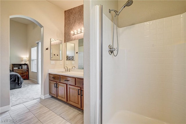 67 Dow Jones St Unit 2, Henderson, NV 89074 - full bathroom with vanity, a shower, ensuite bathroom, tile patterned flooring, and baseboards