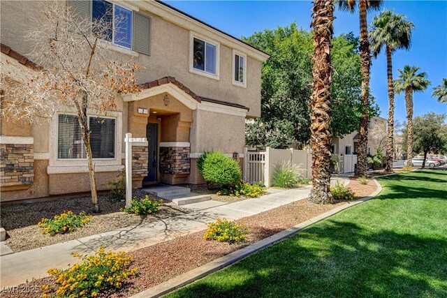 67 Dow Jones St Unit 2, Henderson, NV 89074 - view of front of property featuring stucco siding and stone siding