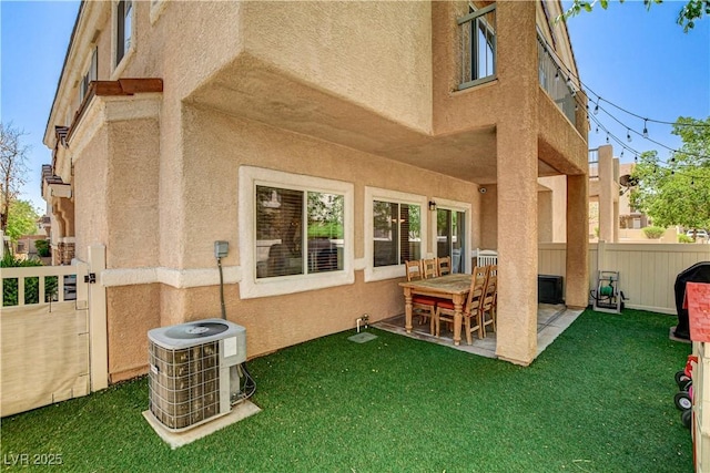 67 Dow Jones St Unit 2, Henderson, NV 89074 - rear view of property with central AC unit, stucco siding, and a patio area