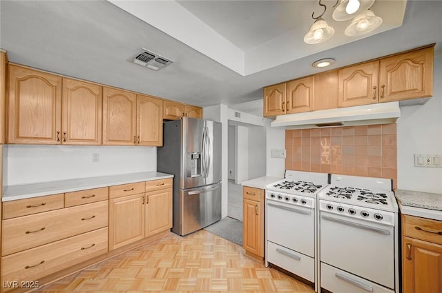 3143 El Chico Ct, Las Vegas, NV 89120 - kitchen featuring stainless steel refrigerator with ice dispenser, white range with gas cooktop, under cabinet range hood, and light countertops